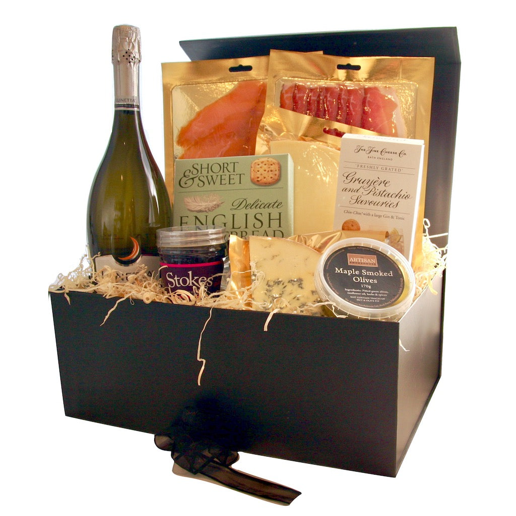 A luxury hamper containing a bottle of Prosecco