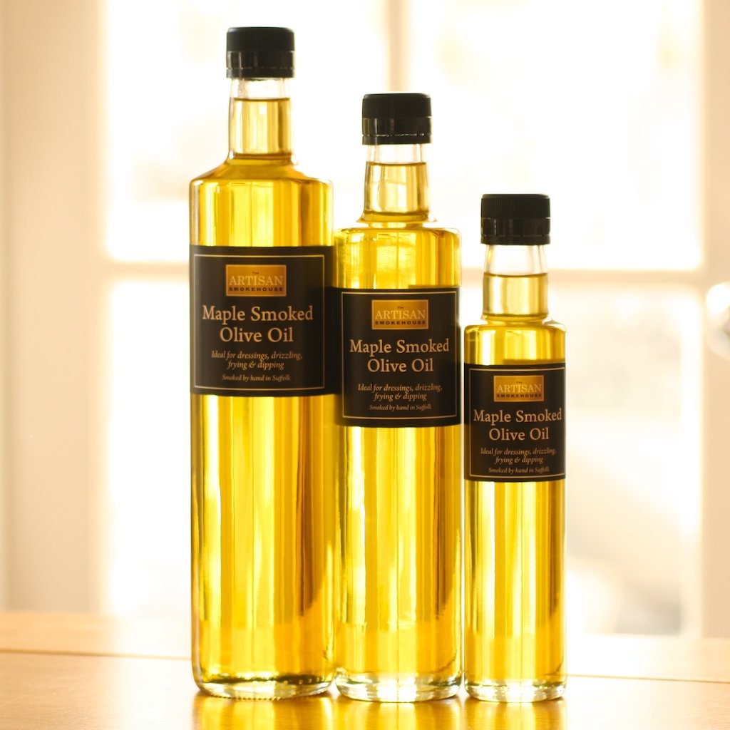 Three different size bottles of The Artisan Smokehouse's smoked Italian olive oil