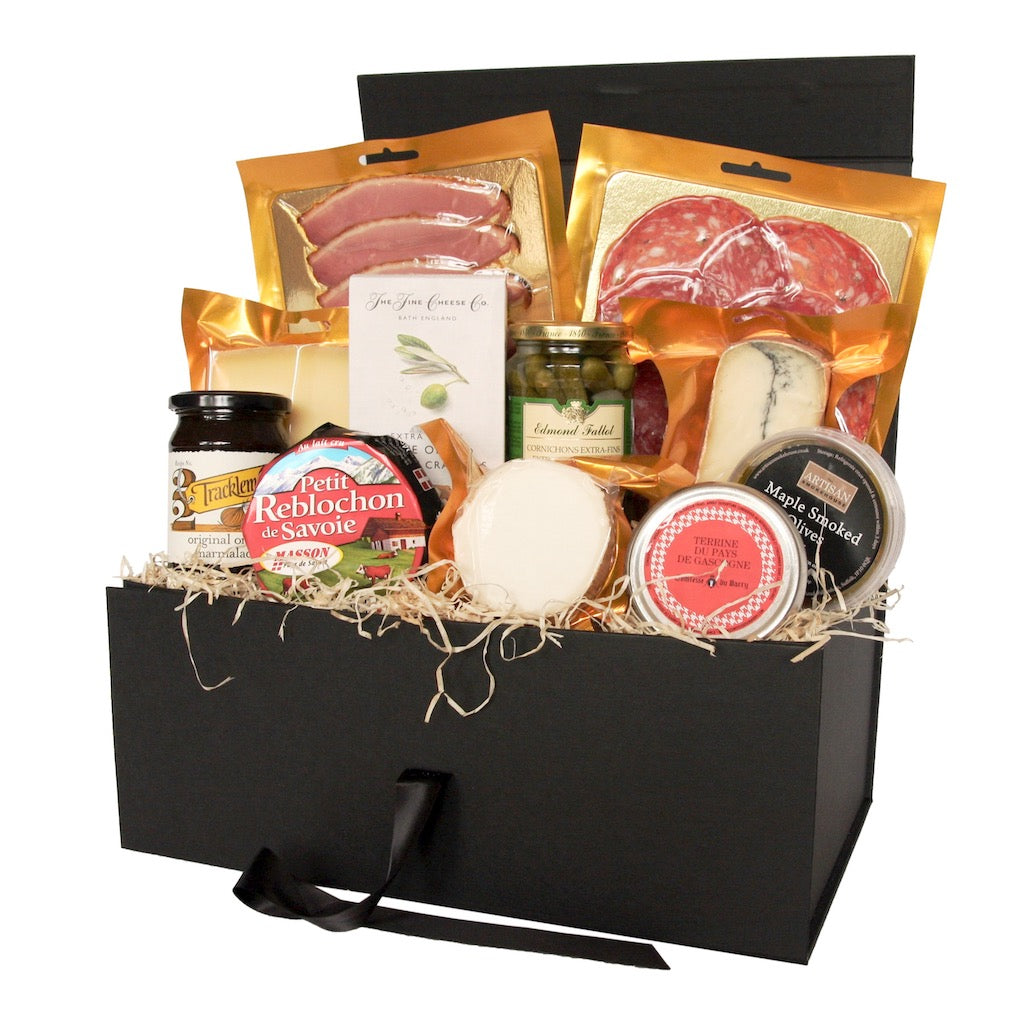 An Artisan Smokehouse luxury food hamper with contents on show