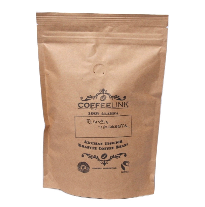 A brown kraft paper stand-up pouch of Coffeelink coffee beans on a plain white background.