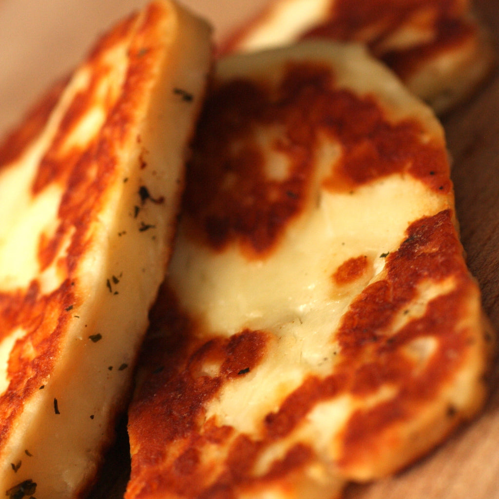 Fried smoked halloumi cheese on board