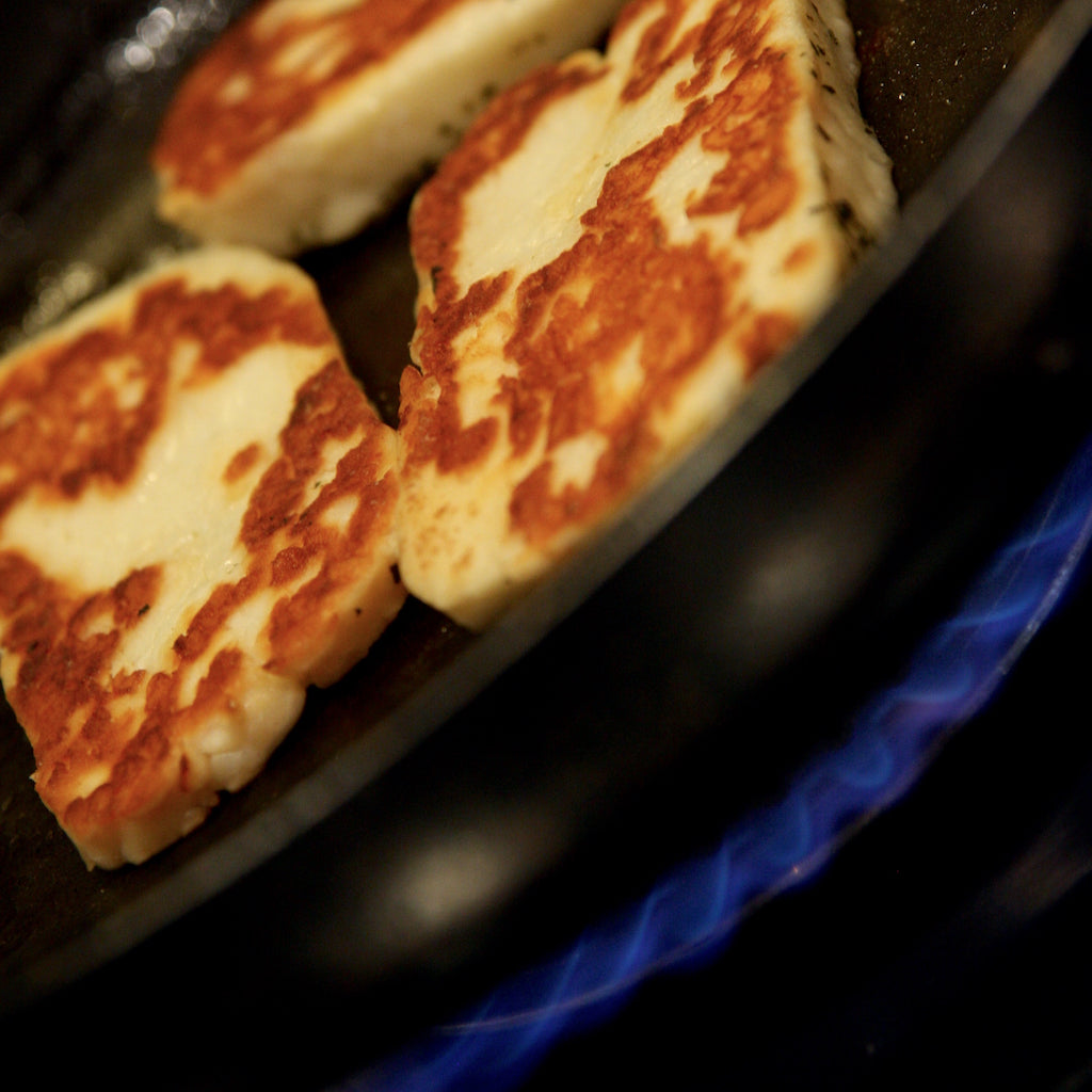 Smoked halloumi cheese dry-frying in pan