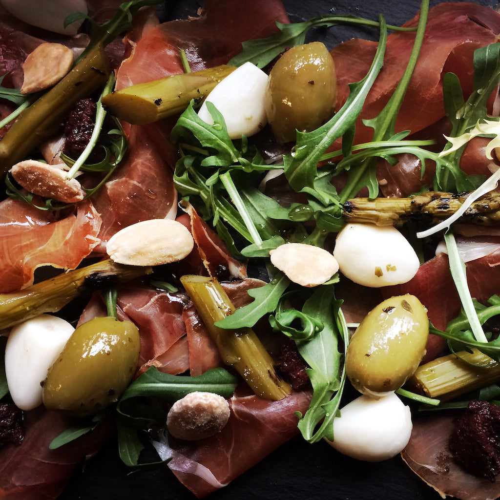 Smoked Prosciutto ham with asparagus, rocket and smoked almonds
