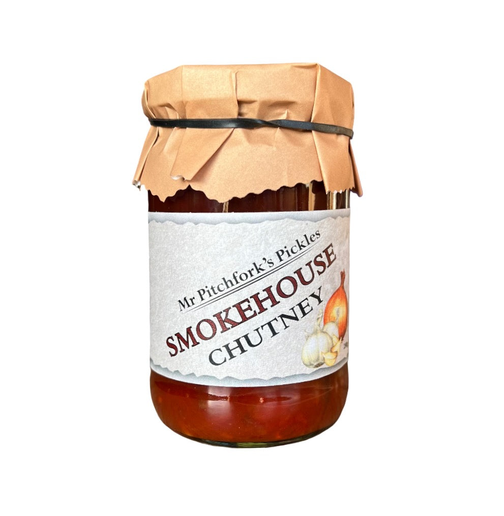 Jar of Smokehouse Chutney with a paper cover on a white background