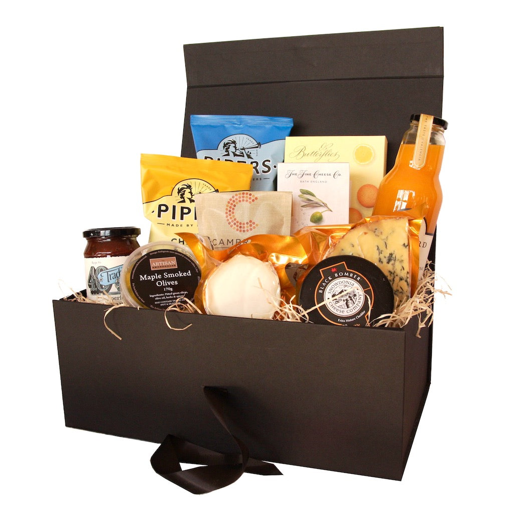 The Artisan Smokehouse's Vegetarian Picnic Hamper containing cheeses, crackers, chutney, crisps, nuts, olives, orange juice and biscuits 