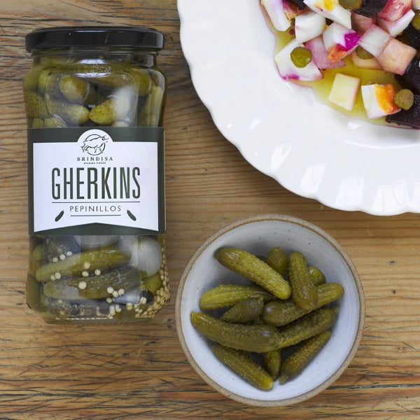 Cocktail gherkins in jar and in bowl