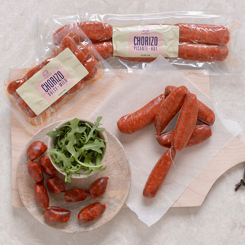 Spanish cooking chorizo in packets and on chopping board