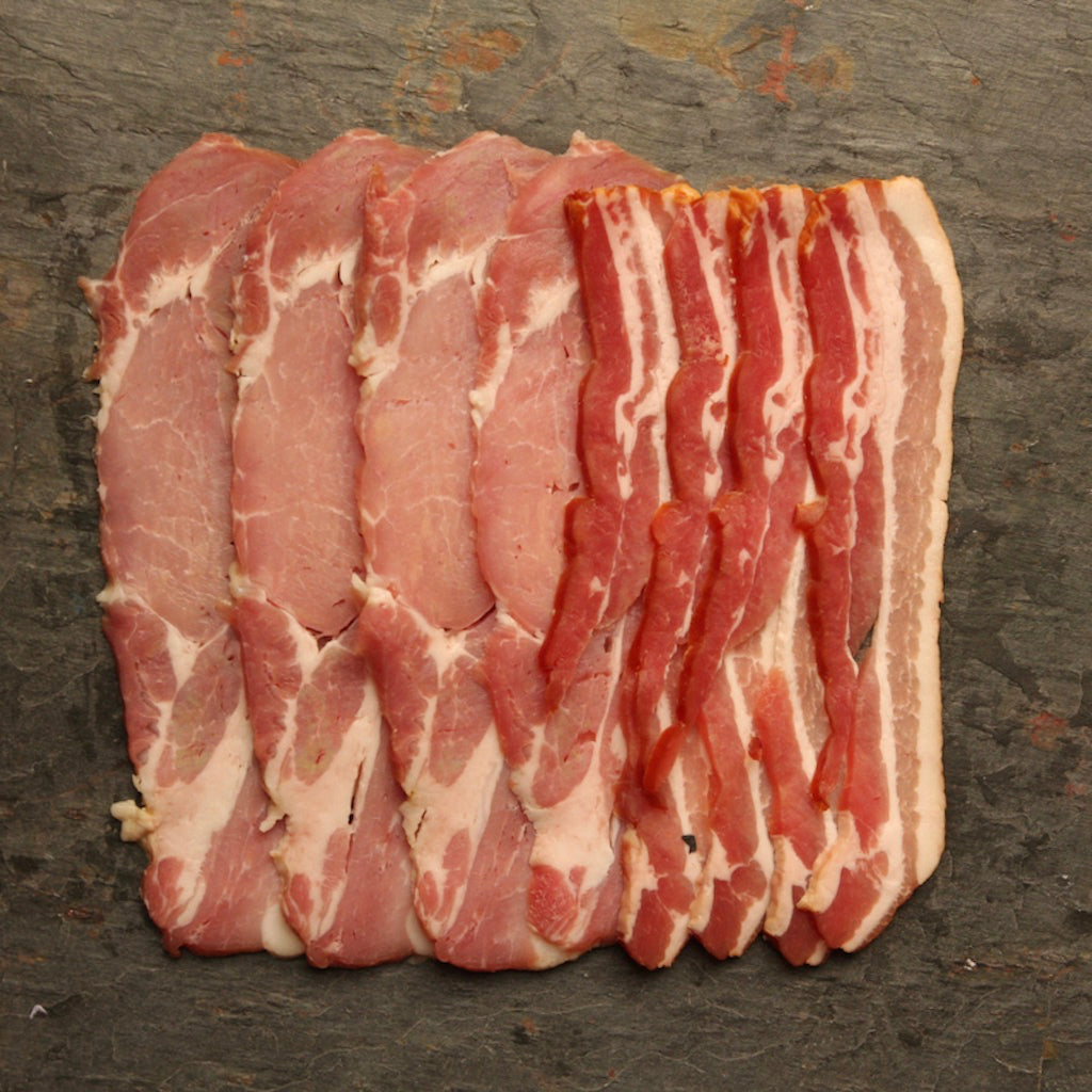 Rashers smoked back bacon and smoked streaky bacon on slate