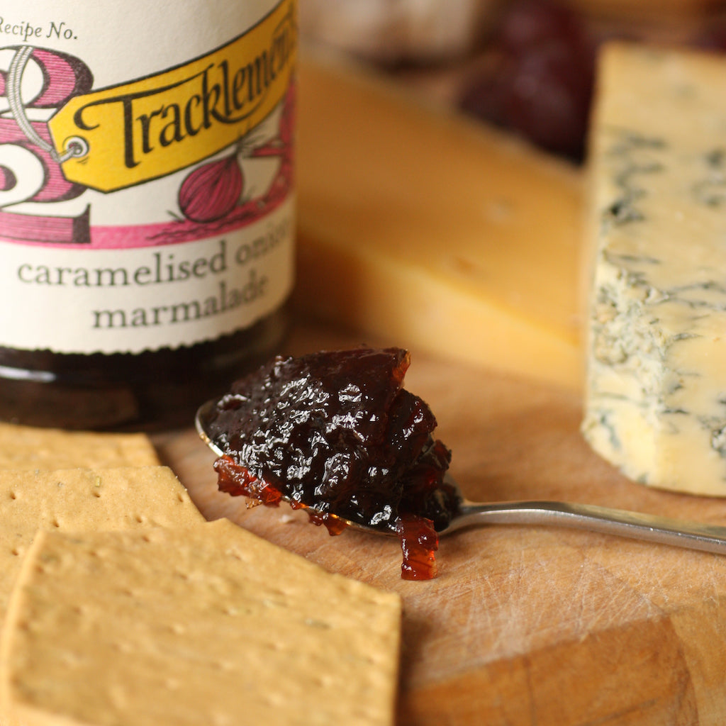 Smoked Stilton with chutney and crackers on cheese board