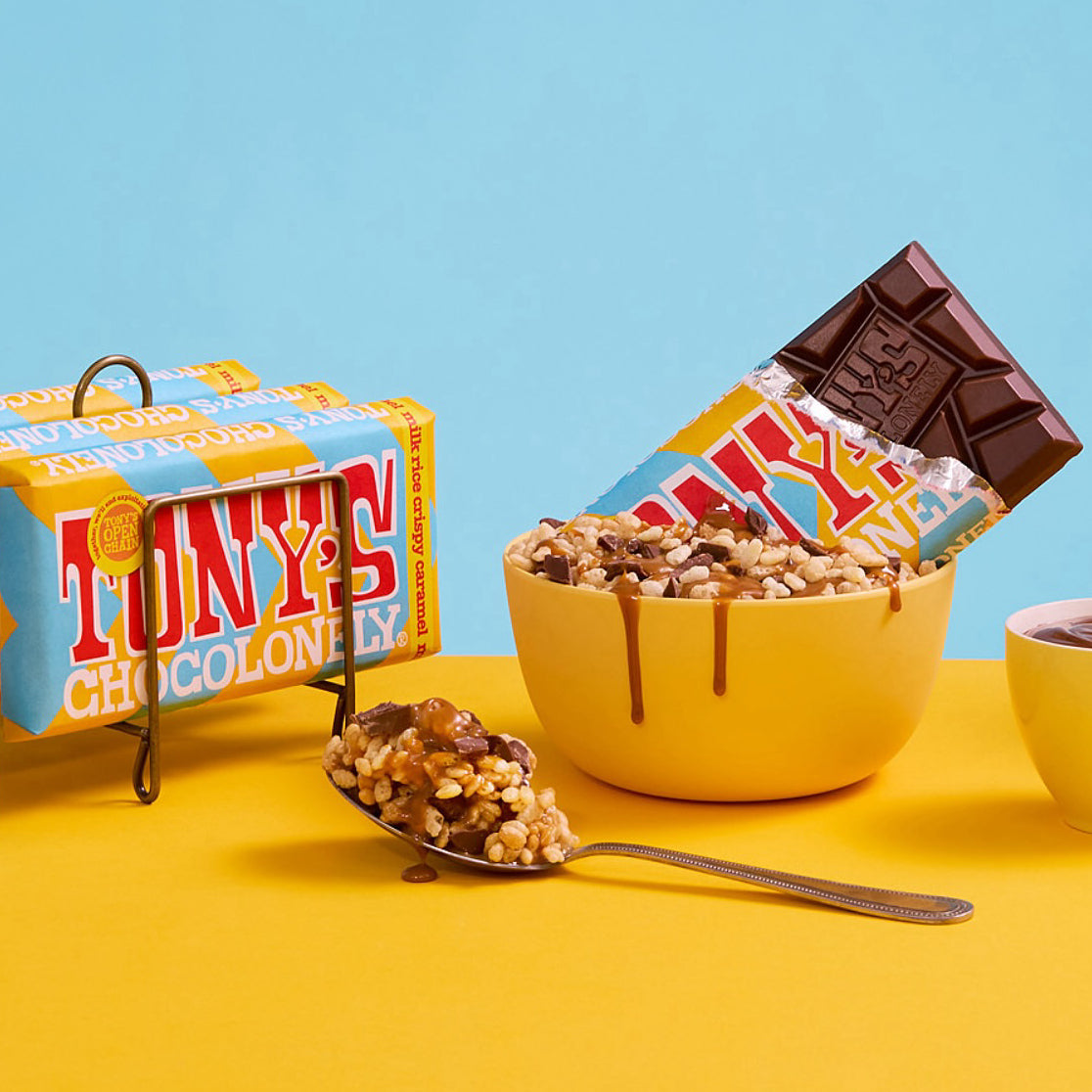 A bar of Tony's Chocolonely on a yellow and blue background