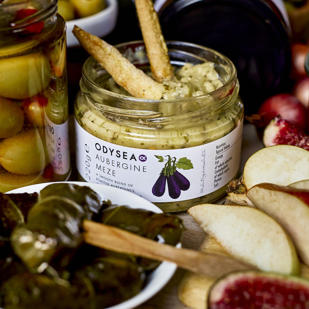 A jar of aubergine Meze served with bread sticks