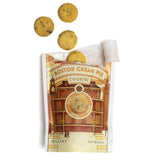 A bag labeled 'Boston Cream Pie Cookies', shown on a white background with several round chocolate chip cookies floating above it.