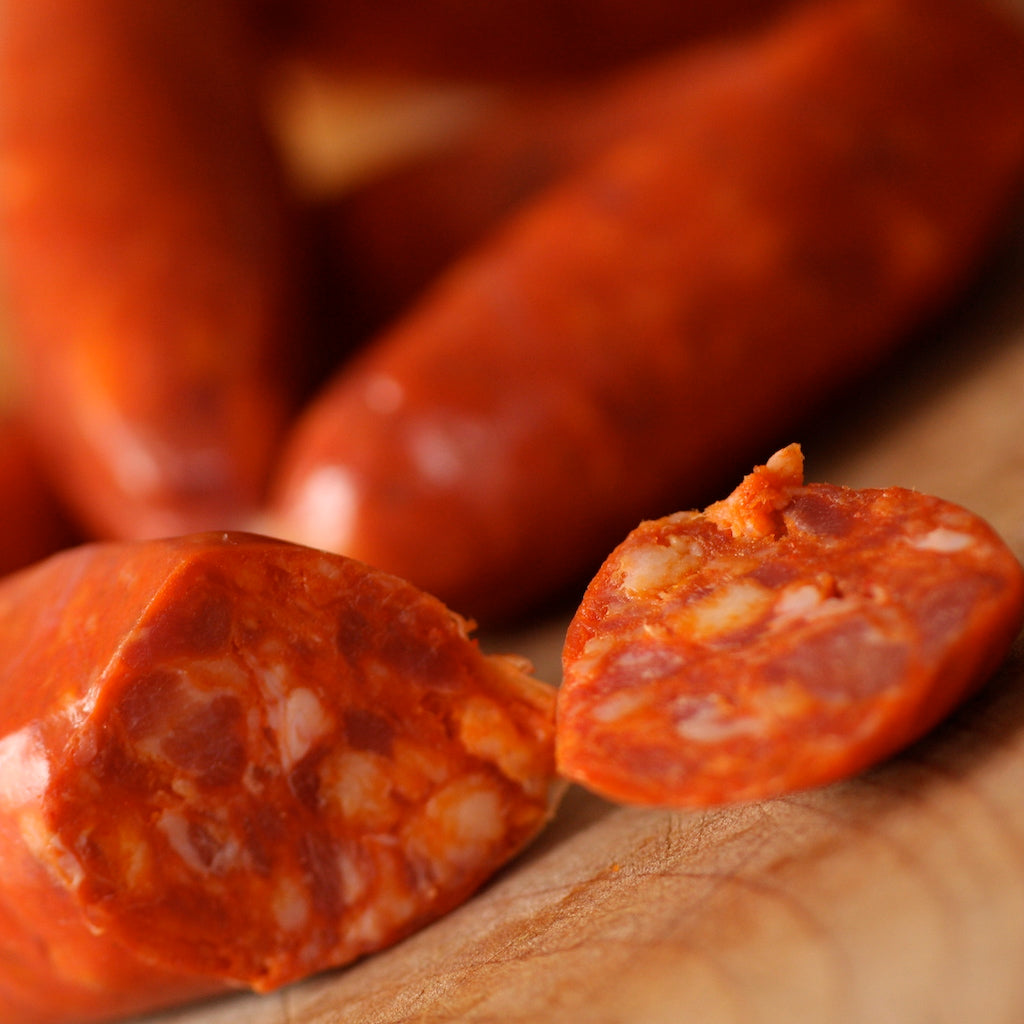 Spicy chorizo sausage on chopping board