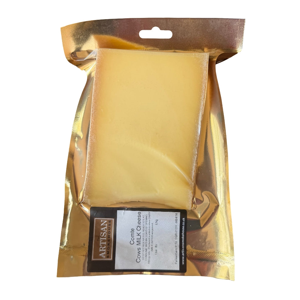 A packaged block of Comte cheese in a shiny gold foil pouch with a hanging tab, on a plain white background.