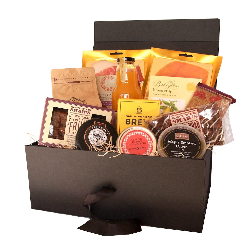 The Artisan Smokehouse's Extravagant Afternoon Tea Hamper containing meats, cheese, smoked salmon, terrine, biscuits, cakes, tea, coffee and orange juice