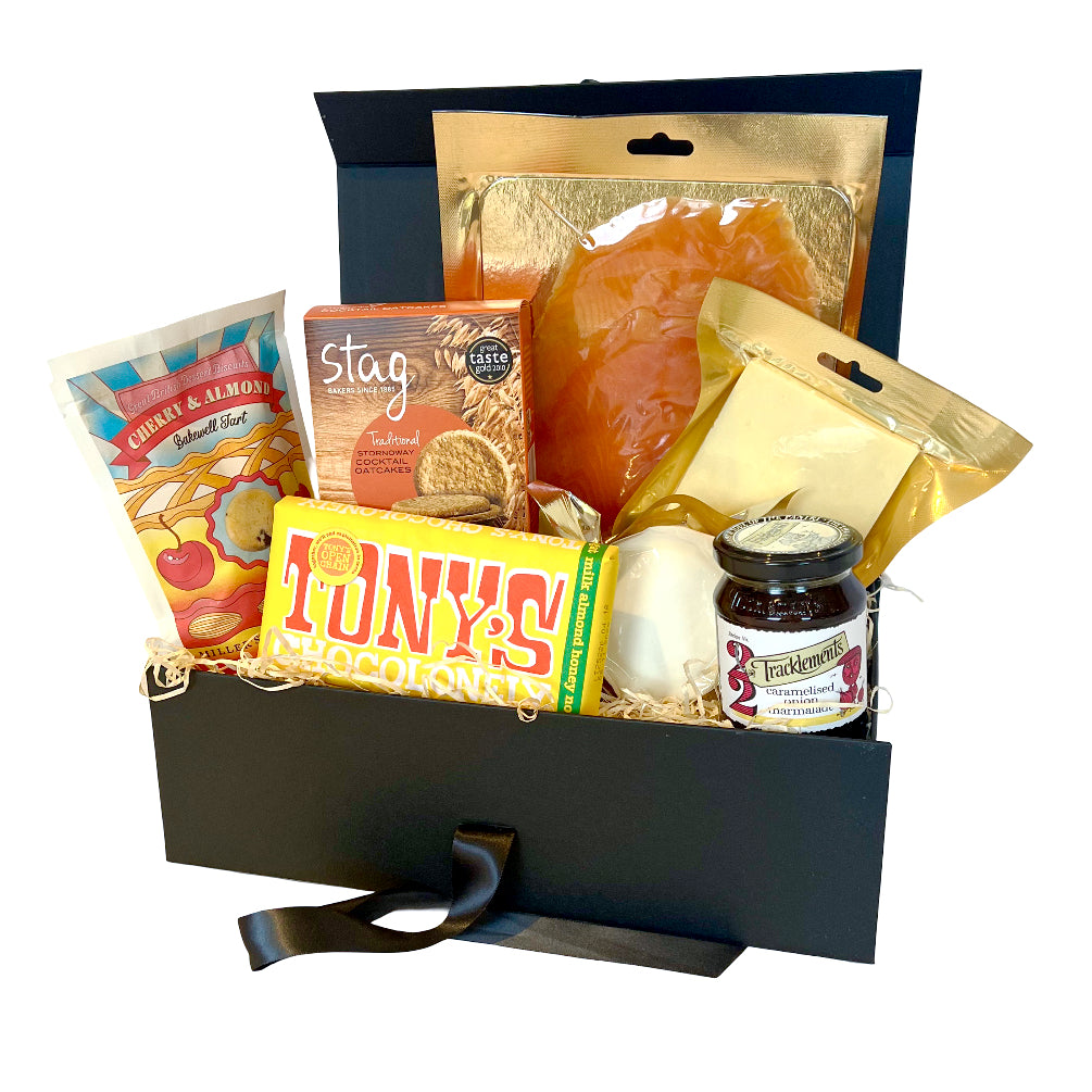 Hamper For her with various items including Tony's chocolate, smoked salmon, and other snacks.