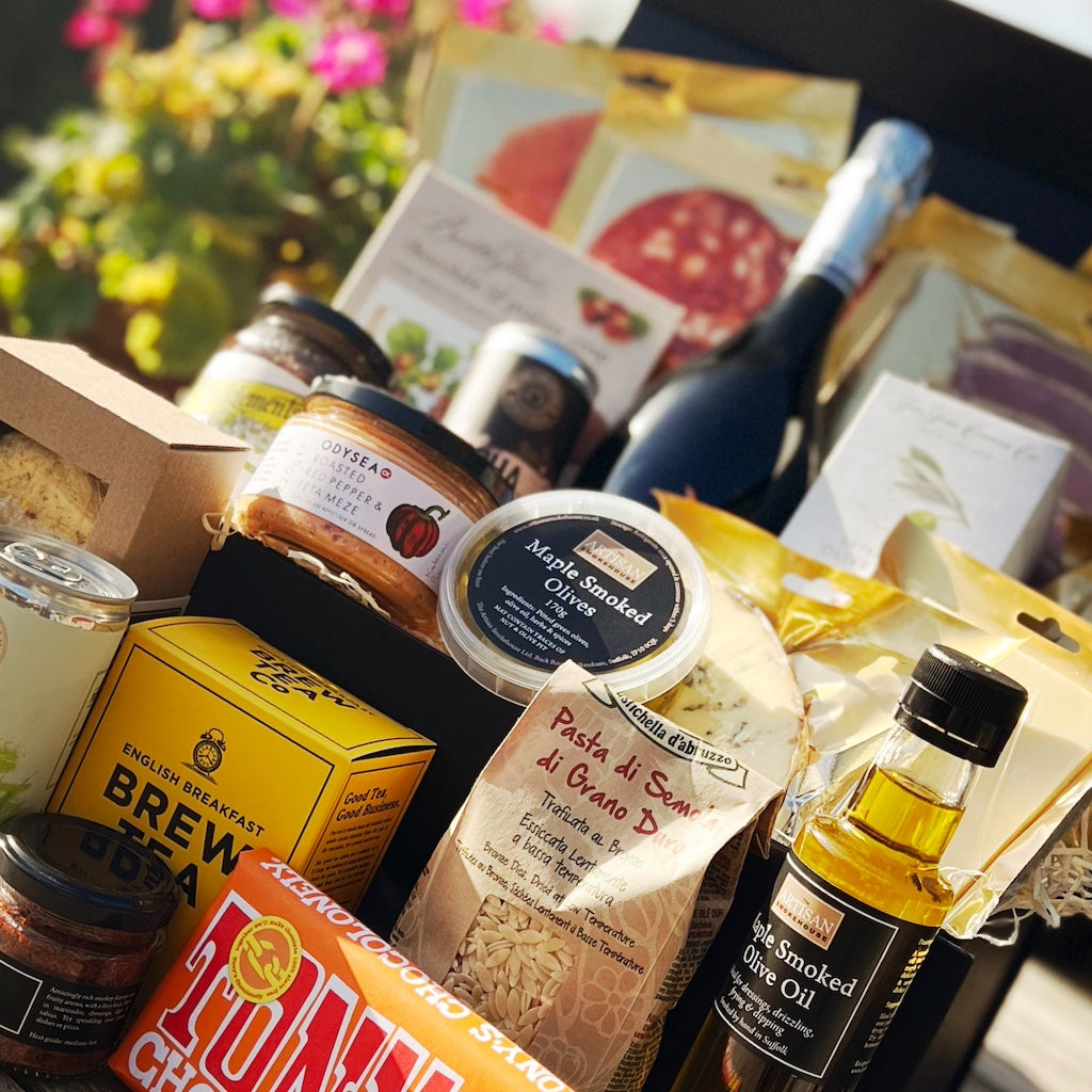 An Artisan Smokehouse luxury hamper on picnic bench