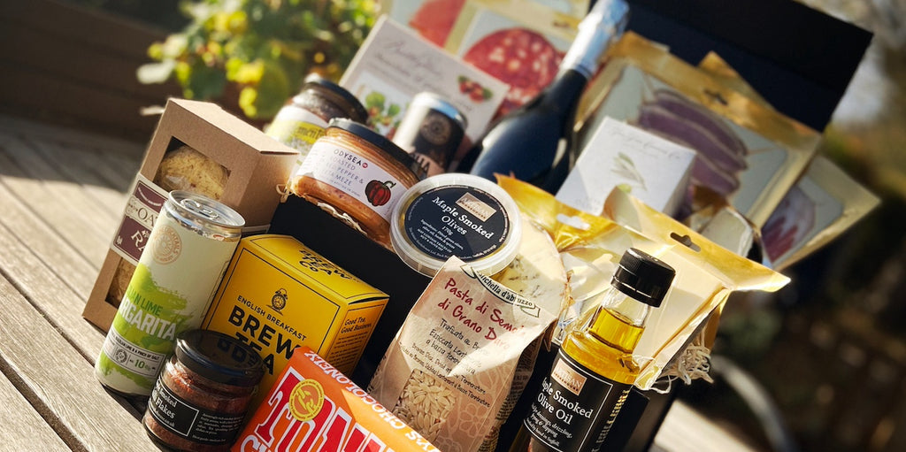 An Artisan Smokehouse luxury hamper on picnic bench