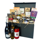 The luxury Vegan Hamper with various food items and drinks on a white background