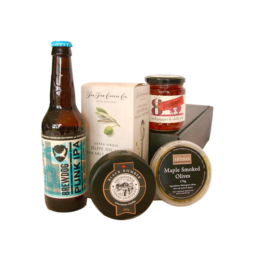 The Artisan Smokehouse's Mini Cheese Hamper containing cheese, crackers, chutney, olives and beer
