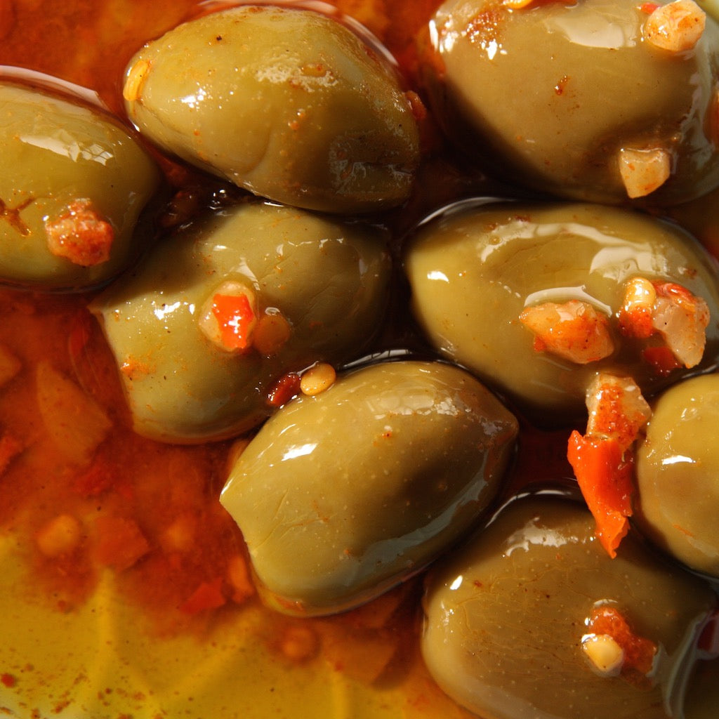A bowl of mild chilli marinade olives
