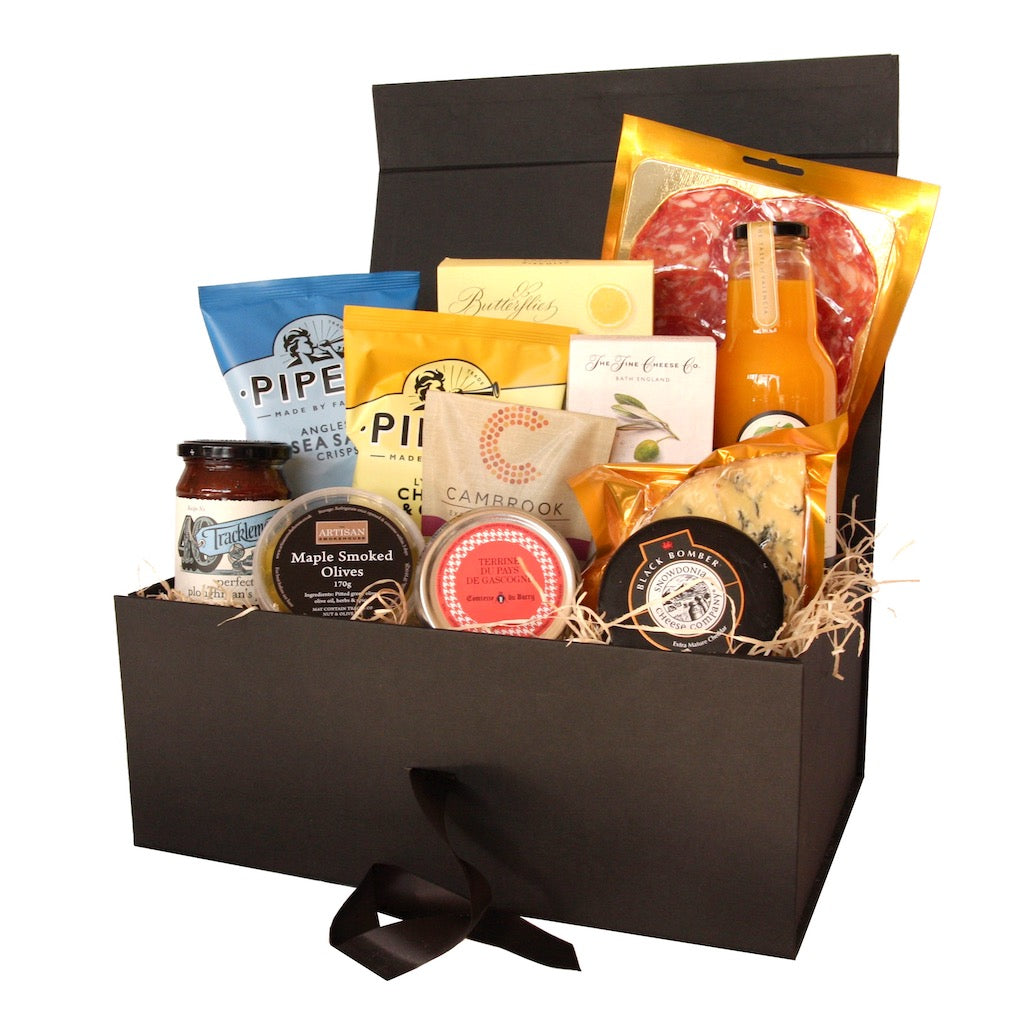 The Artisan Smokehouse's Picnic Hamper containing meats, cheese, terrine, crackers, olives, chutney, crisps, nuts, and biscuits