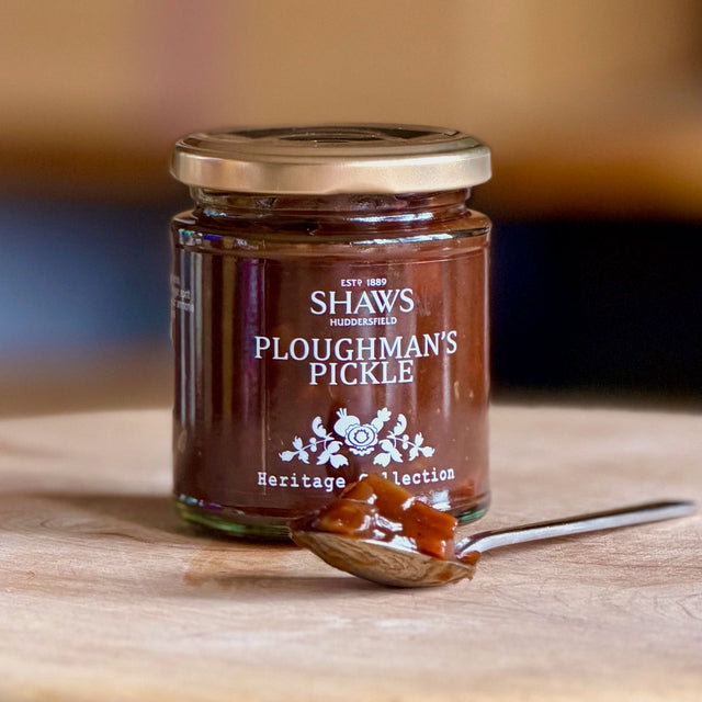 A Jar of Shaws Ploughman's Pickle on a wooden board