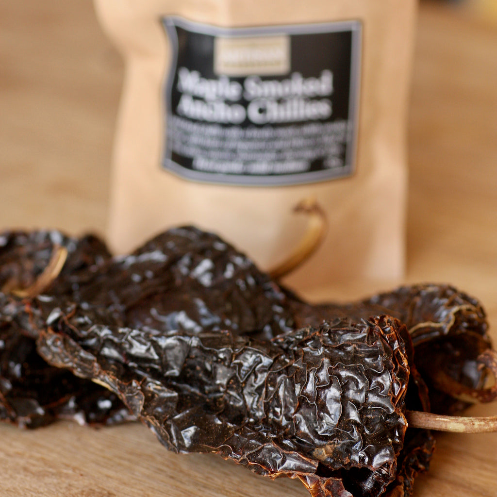 The Artisan Smokehouse's smoked dried ancho chillies in packet and on chopping board