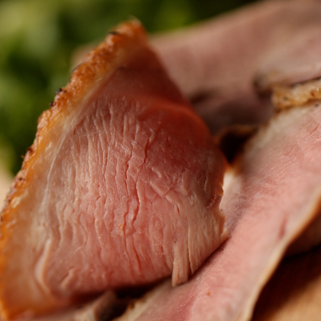 Slices of The Artisan Smokehouse's smoked free-range duck breast served with a salad