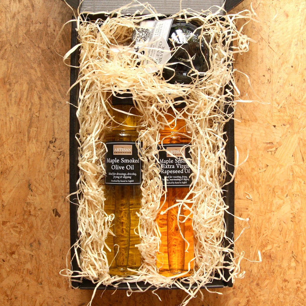 The Artisan Smokehouse's smoked oils & vinegar hamper with contents on show 