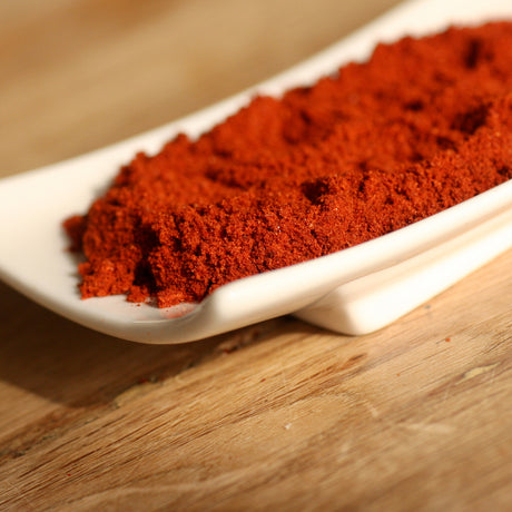 Smoked paprika in ramekin on board