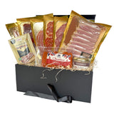 A gourmet meat hamper box filled with various cured meat and snacks. 