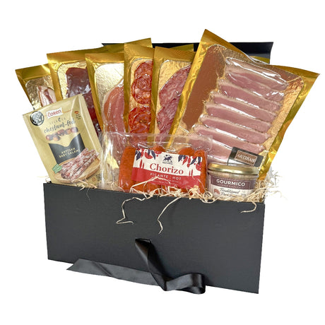 A gourmet meat hamper box filled with various cured meat and snacks. 