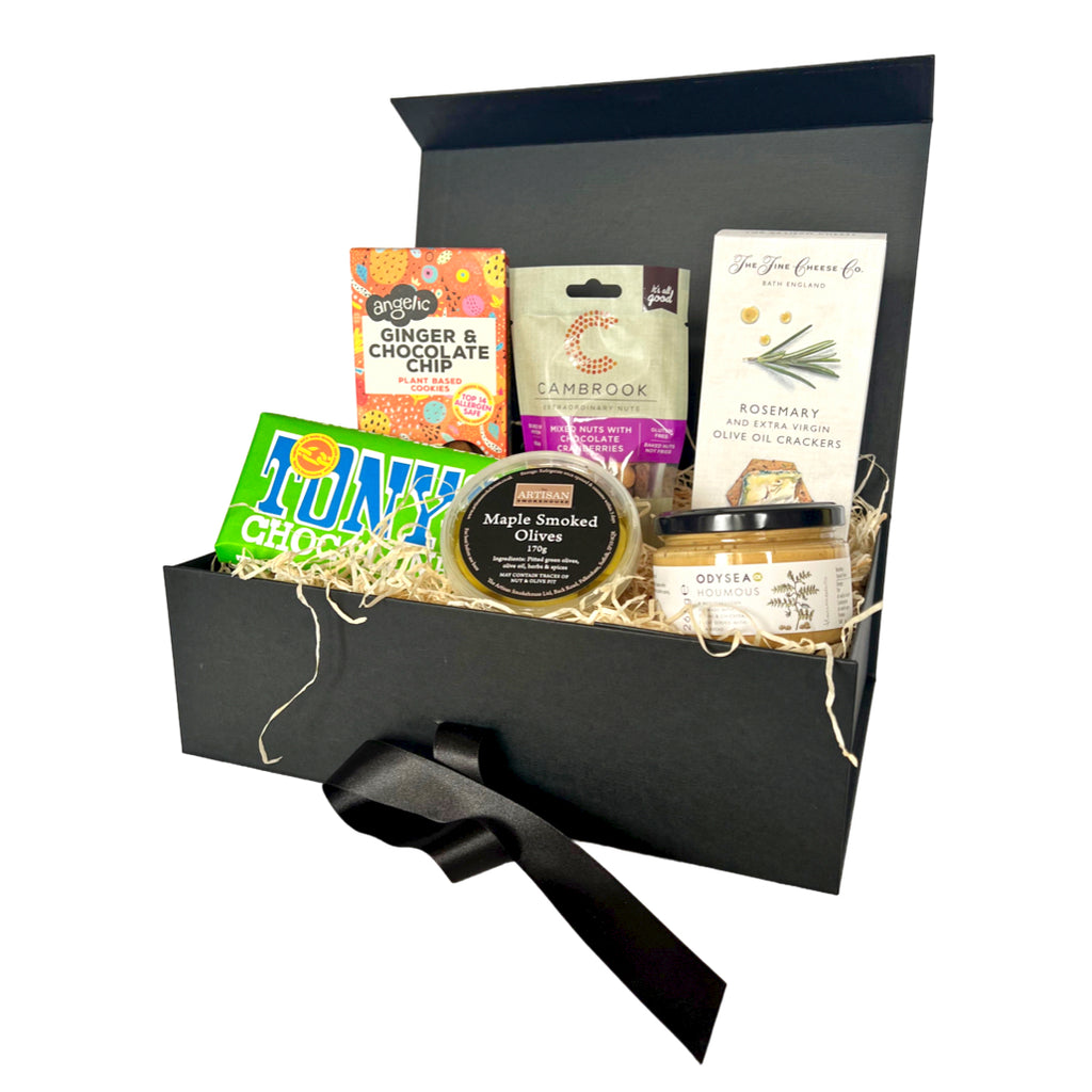 The Artisan Smokehouse's Vegan Treats hamper containing cookies, chocolate, crackers, houmous and smoked olives