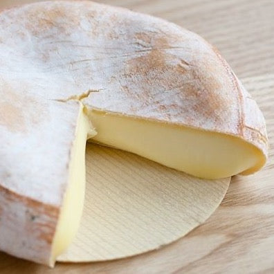 A round of Reblochon on cheese board