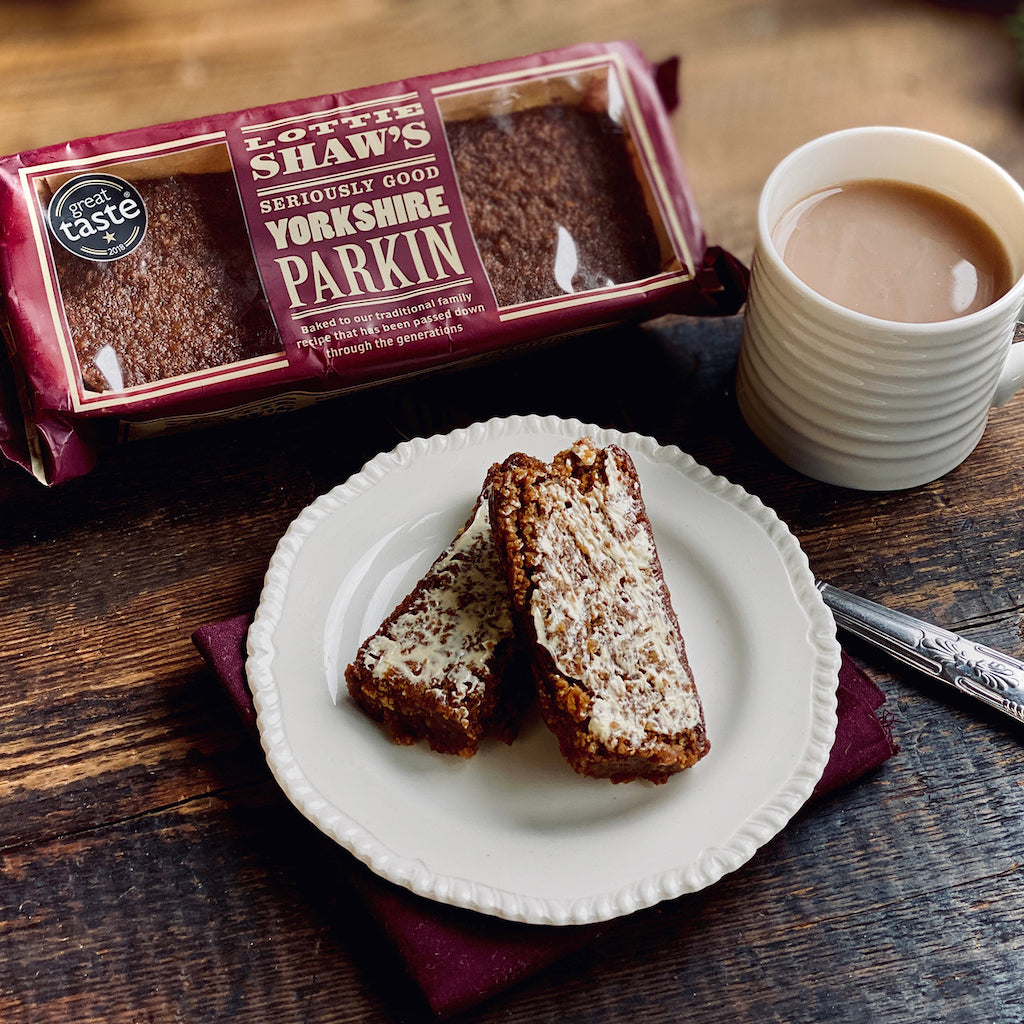 Yorkshire Parkin on a plate with a mug of tea