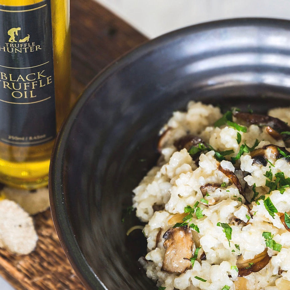 A mushroom risotto served with Truffle Hunter Black Truffle Oil 