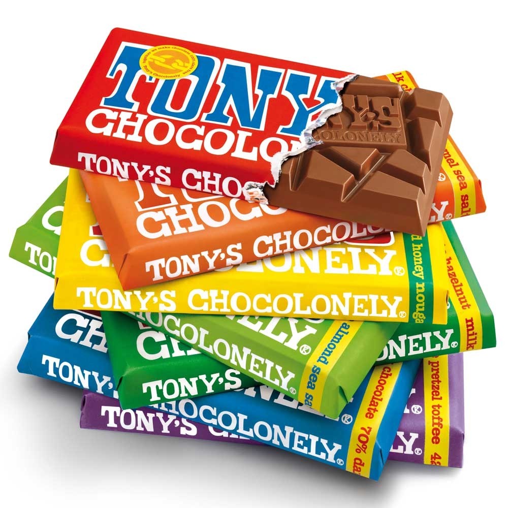 A stack of Tony's Chocolonely Fairtrade chocolate bars