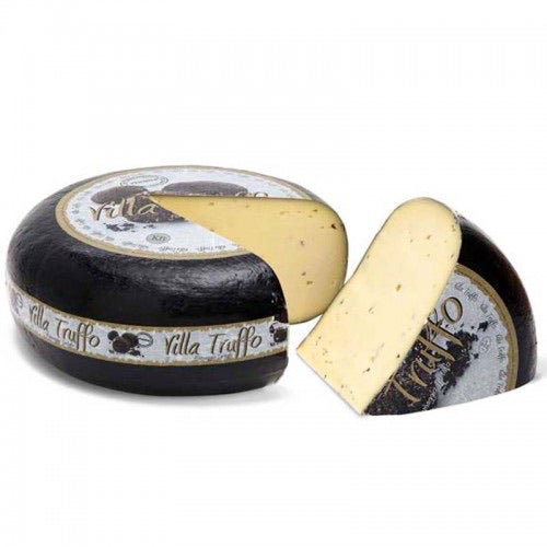 A whole round of Truffle Gouda with piece cut out